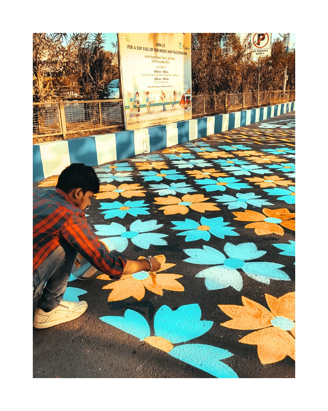 art street wall painting , at eco park newtown , tanmoy paul of oikar studio painting himself