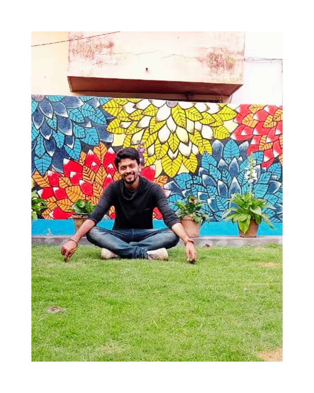 Tanmoy paul founder of oikar studio, nouka art at bhirab ganguly college garden , after painting the wall mural , wall design art by himself