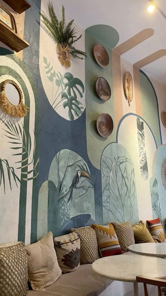 Sustainable wall art with abstract botanical mural and arched design in cozy seating area