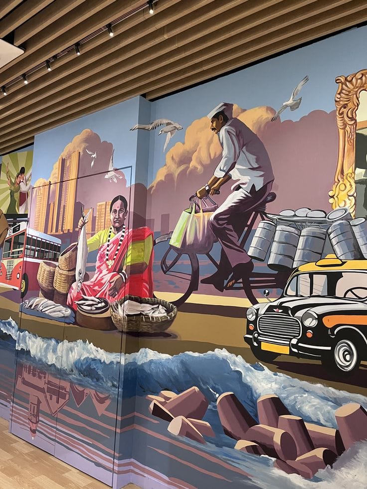 Hand-painted Kolkata city mural featuring Howrah Bridge, tram, rickshaw, and cultural figure wall art in a modern living room.