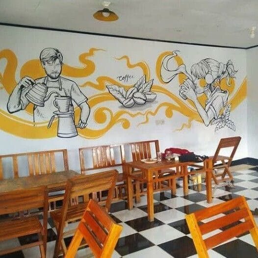 Hand-painted restaurant wall mural with cartoon-style dining scenes, food illustrations, and lively café atmosphere artwork
