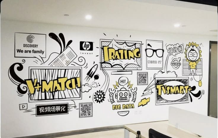 A white office wall covered in black-and-white hand-drawn style doodles, including tech company logos, robots, and comic-style speech bubbles with yellow accents.