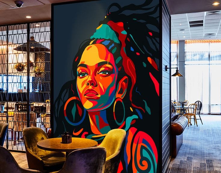 Colorful pop art mural featuring a stylized female portrait with bold neon patterns and flowing abstract designs on a commercial interior wall.