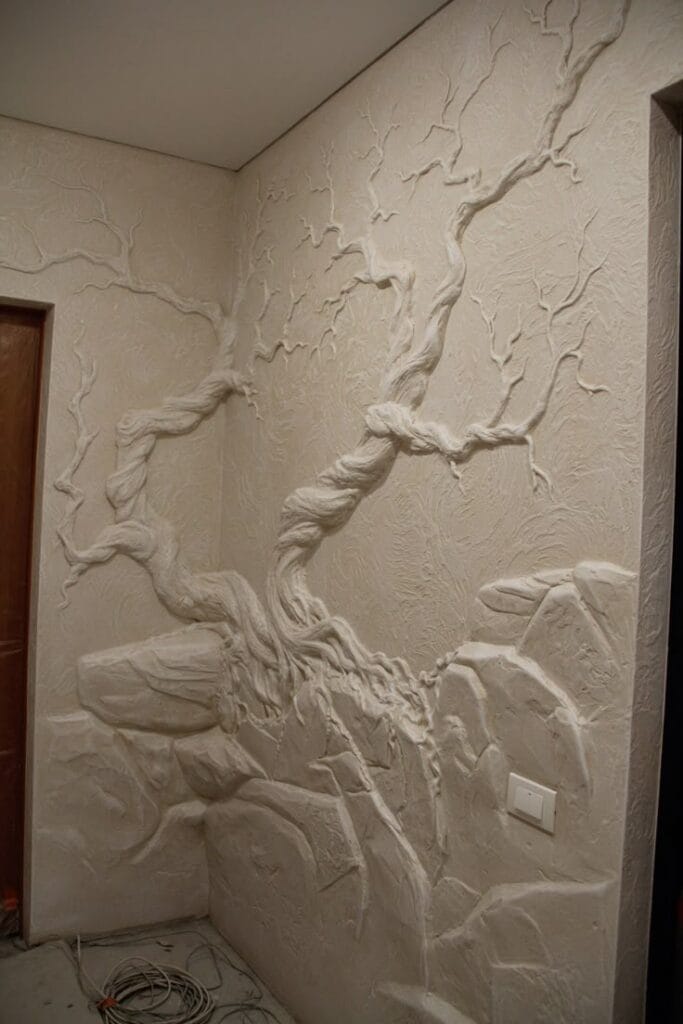 Handcrafted dry wall art medium tree relief mural with textured branches and stone base design